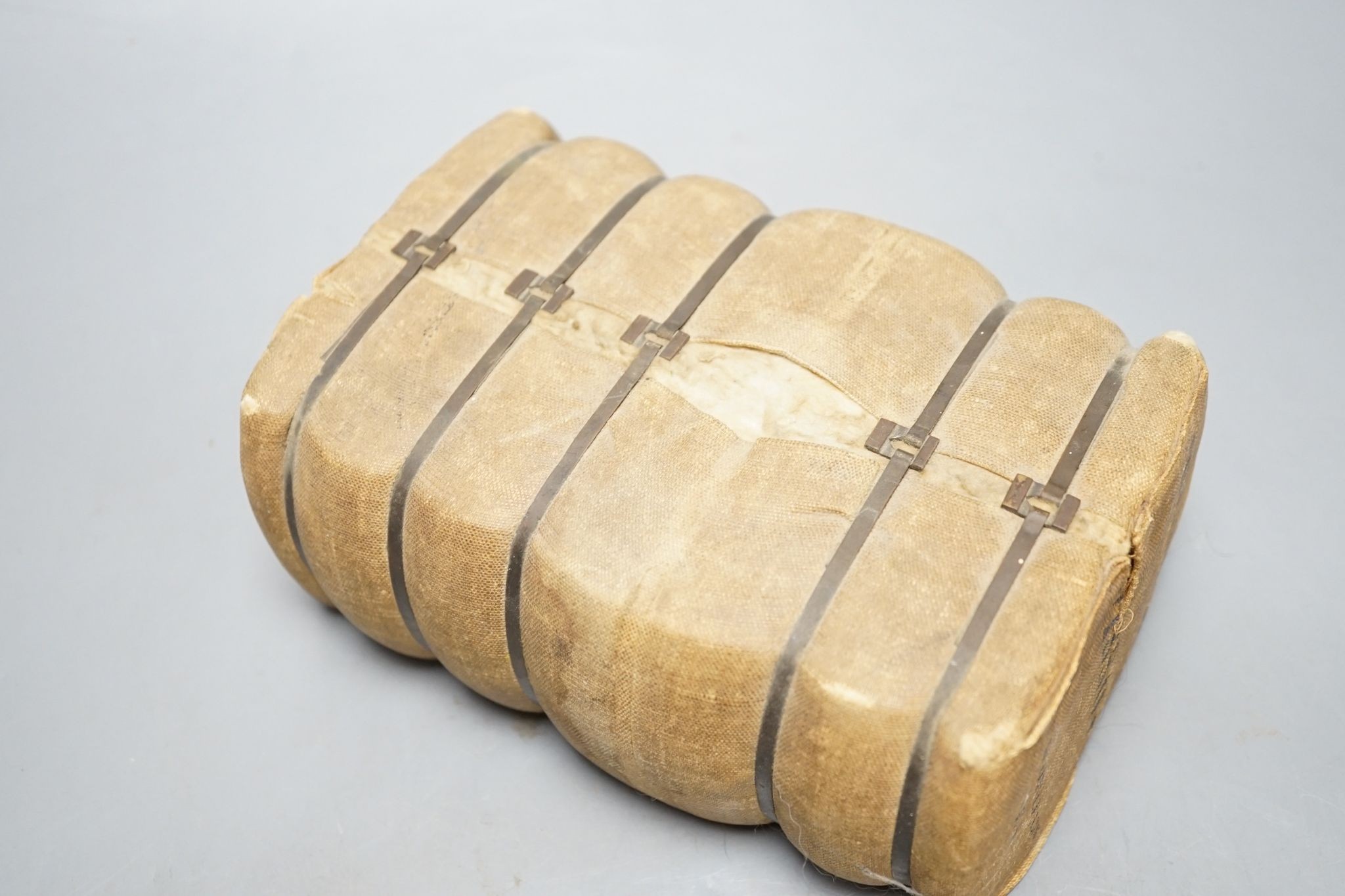 An alabaster fruit carving, a Benin brass elephant and salesman's model of a bale of Drysdale cotton, 18 cm